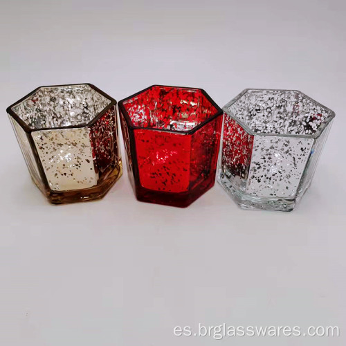 Portavelas de cristal en forma hexagonal con diferentes colores